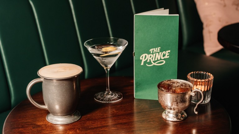 A table in a bar with a selection of cocktails